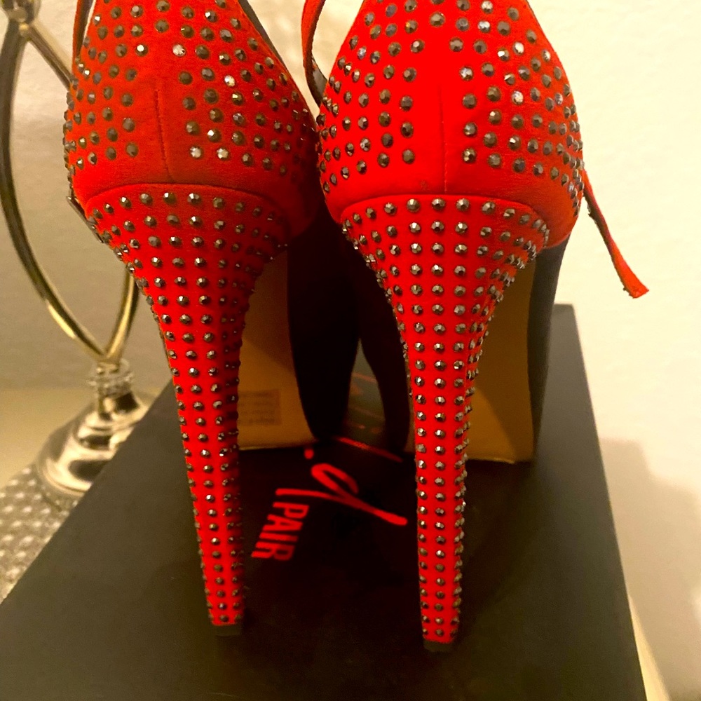 These beautiful red and black suede crystal stilettos are show stopper